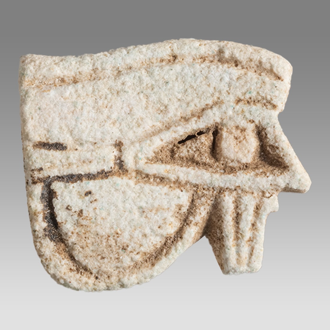 Ancient Egyptian Faience Amulet, Eye Of Horus c.664-332 BC.: Ancient Egyptian Faience Amulet, Eye Of Horus c.664-332 BC. Size 28 x 16 mm. Fine faience amulet of eye of Horus. Suspension hole through. Provenance: Private collection, bought via London art market,