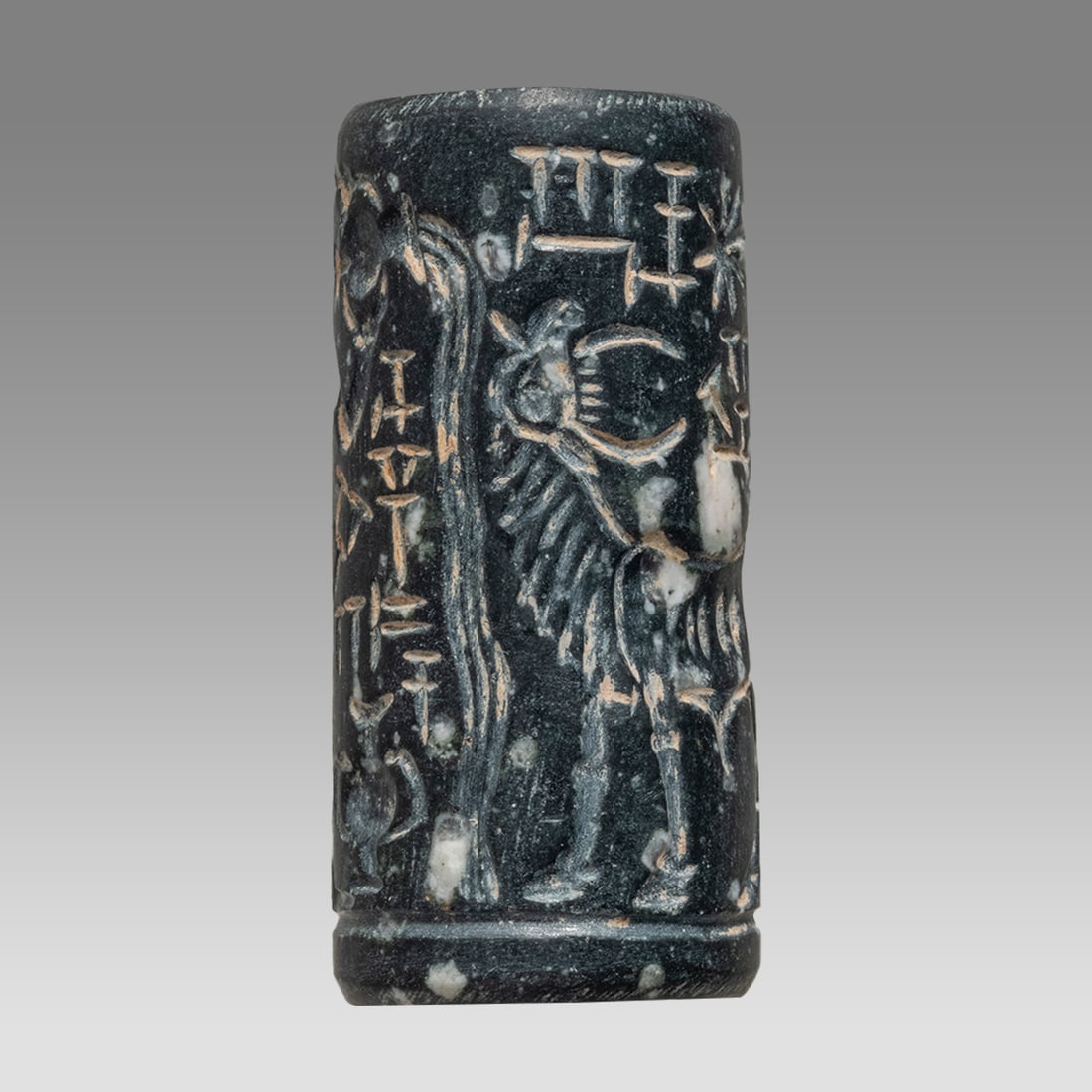 Mesopotamian Style Stone Cylinder Seal.: Mesopotamian Style Stone Cylinder Seal. Size 36 x 16 mm. Carved large stone cylinder seal with presentation scene and Sumerian inscription. suspension hole through. Age unknown. Provenance: Private co