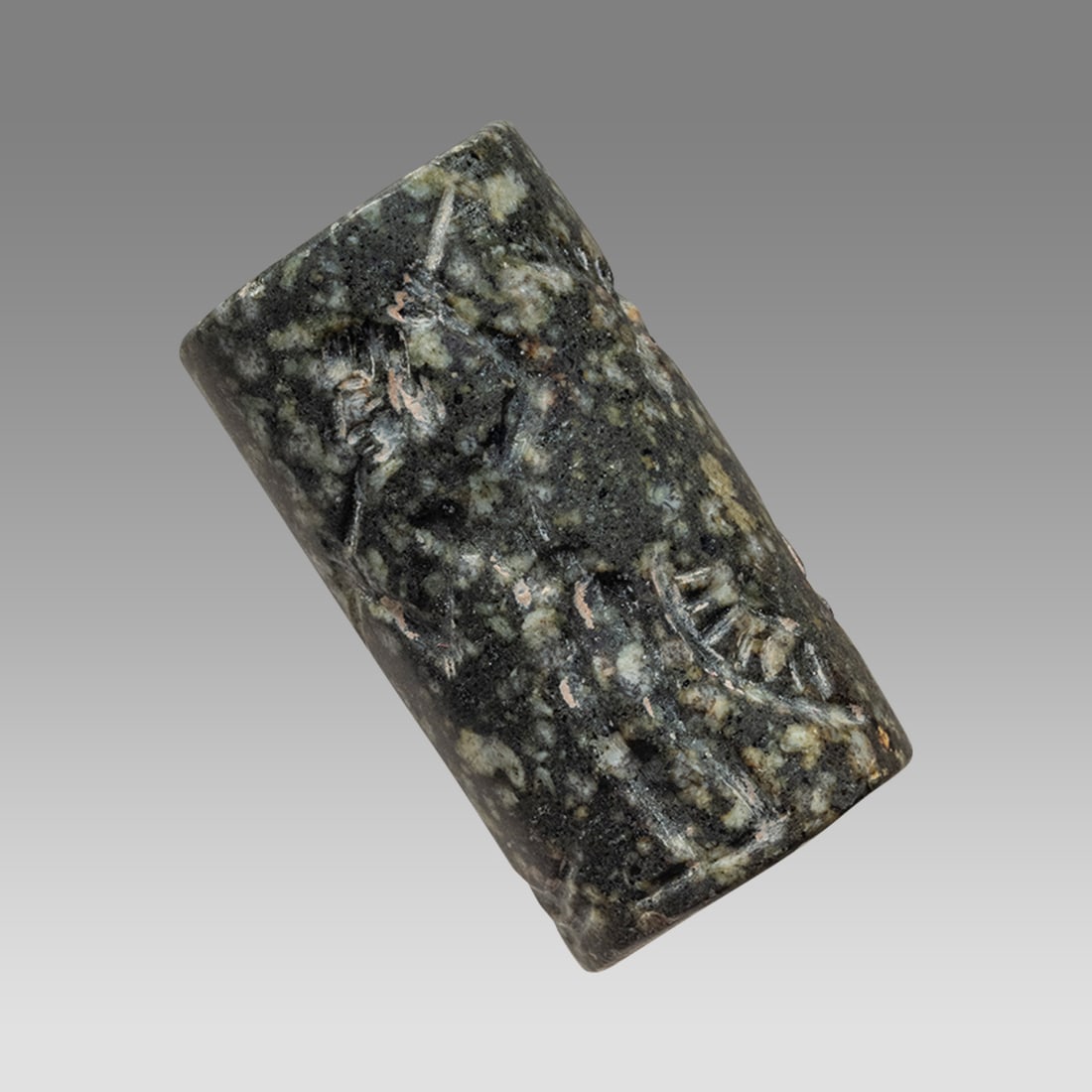 Mesopotamian Black Stone Cylinder Seal.: Mesopotamian Black Stone Cylinder Seal. Size 29 x 15 mm. Carved black stone cylinder seal with hunter and Bird. suspension hole through. Possibly ancient?. Provenance: Private collection, bought in Gr