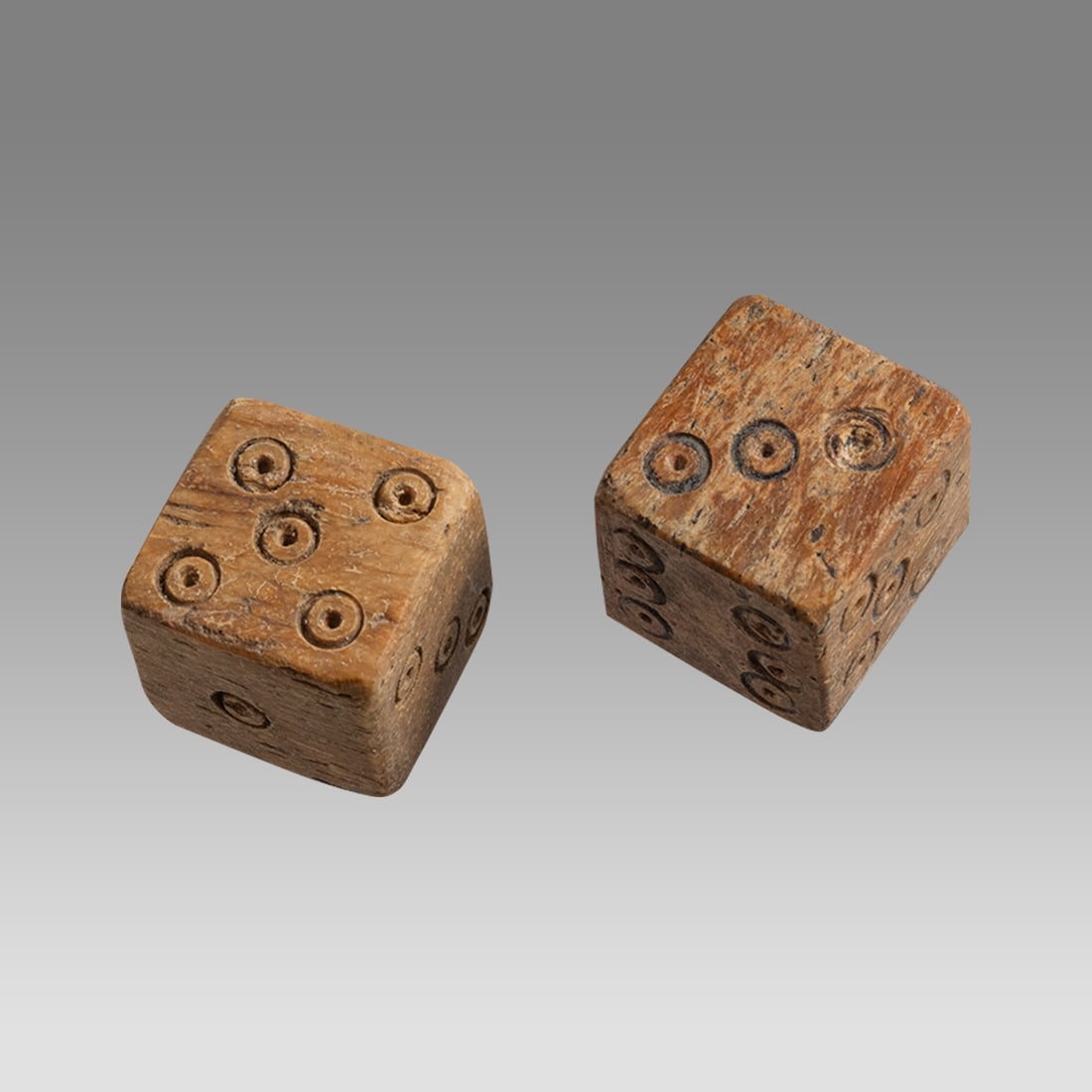 A Pair of Ancient Roman Bone Dice c.2nd-4th century AD.: A Pair of Ancient Roman Bone Dice c.2nd-4th century AD. Size 13 x 13 mm. Carved bone pair of dice. Provenance: Private collection, bought in Grays Market, previously in a 1980s UK collection.
