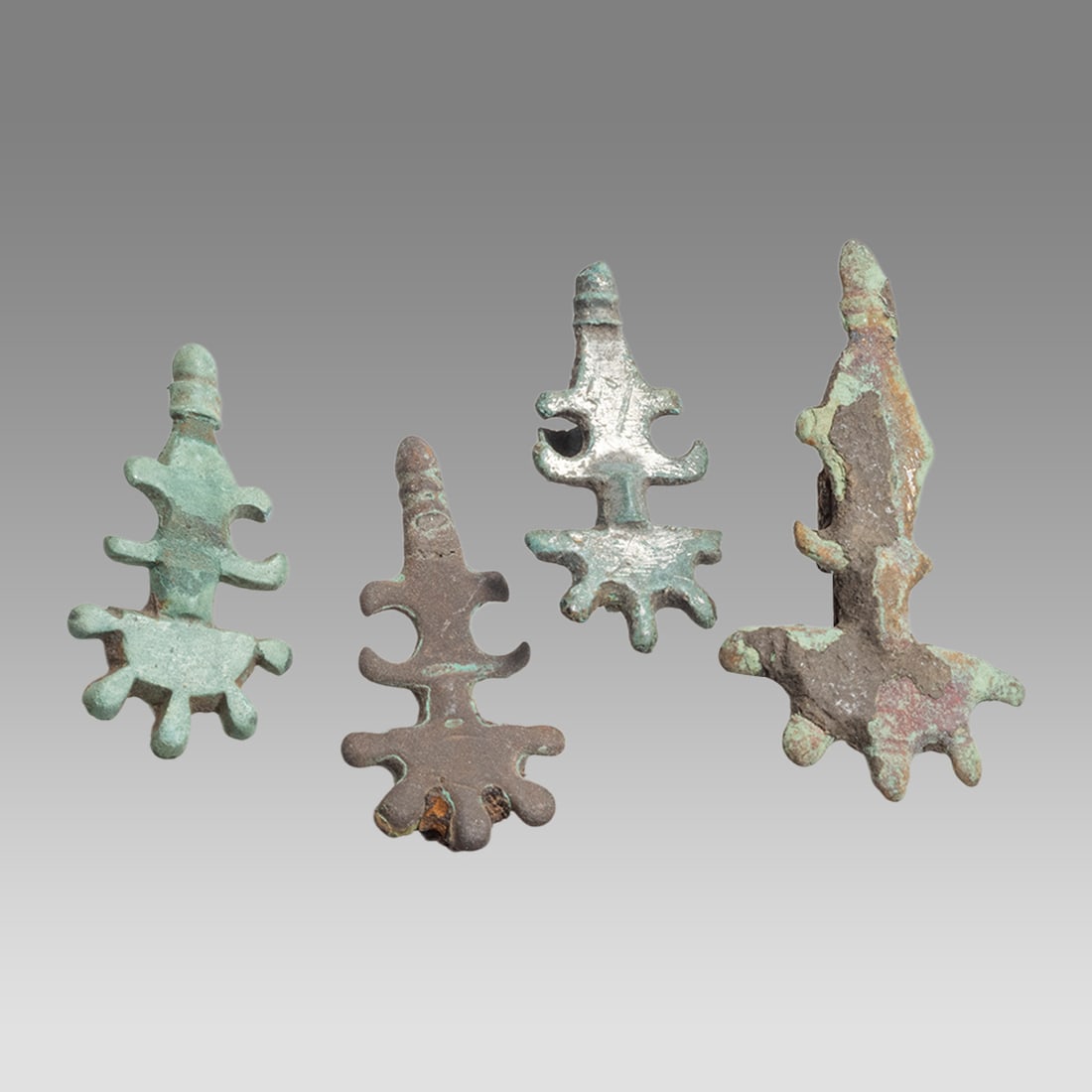 Lot of 4 Ancient Roman Bronze Fibula Brooches c.1st-2nd century AD.: Lot of 4 Ancient Roman Bronze Fibula Brooches c.1st-2nd century AD. Size 1 3/8 - 2 inches length. Cast bronze Fibula brooches, missing pin. Provenance: Private London collection; previously acquired f