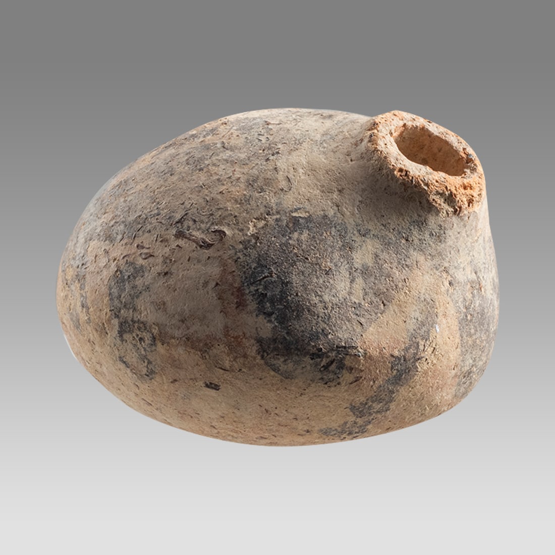 Ancient Mesopotamian Small Terracotta Vessel c.6th century BC.: Ancient Mesopotamian Small Terracotta Vessel c.6th century BC. Size 2 1/4 inches width. A miniature terracotta vessel with small spout, decorated. Provenance: Private collection, bought via London Art