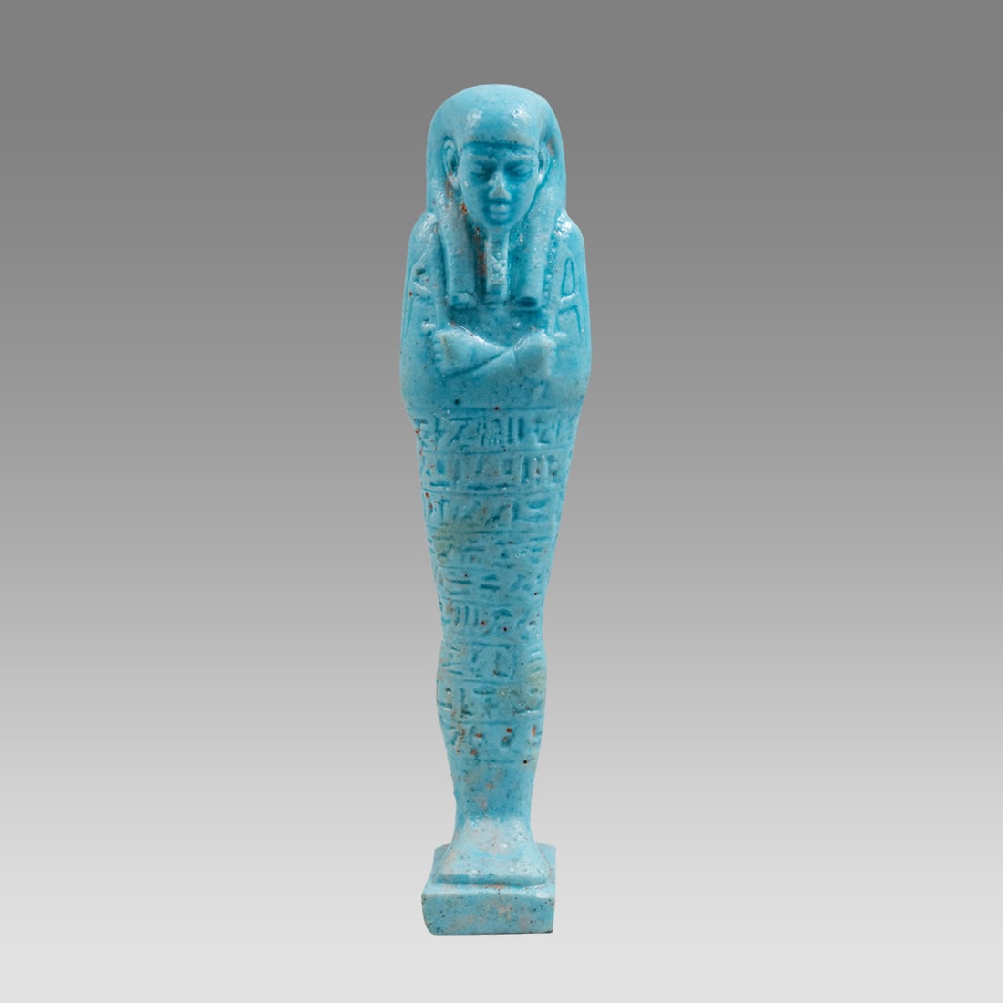 Egyptian Style Blue Faience Ushabti.: Egyptian Style Blue Faience Ushabti. Size 4 1/2 inches hight. A molded blue faience Ushabti figure, with Heiroglyphic text. Not ancient. Provenance: Private collection, bought via London Art Market pr