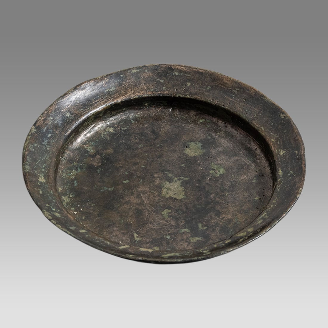 Ancient Sasanian Bronze Minianture Bowl c.5th century AD.: Ancient Sasanian Bronze Minianture Bowl c.5th century AD. Size 3 1/4 inches diameter, 0 1/2 inch high. Shallow miniature bronze bowl, choice patina. Provenance: Private collection, bought via London A