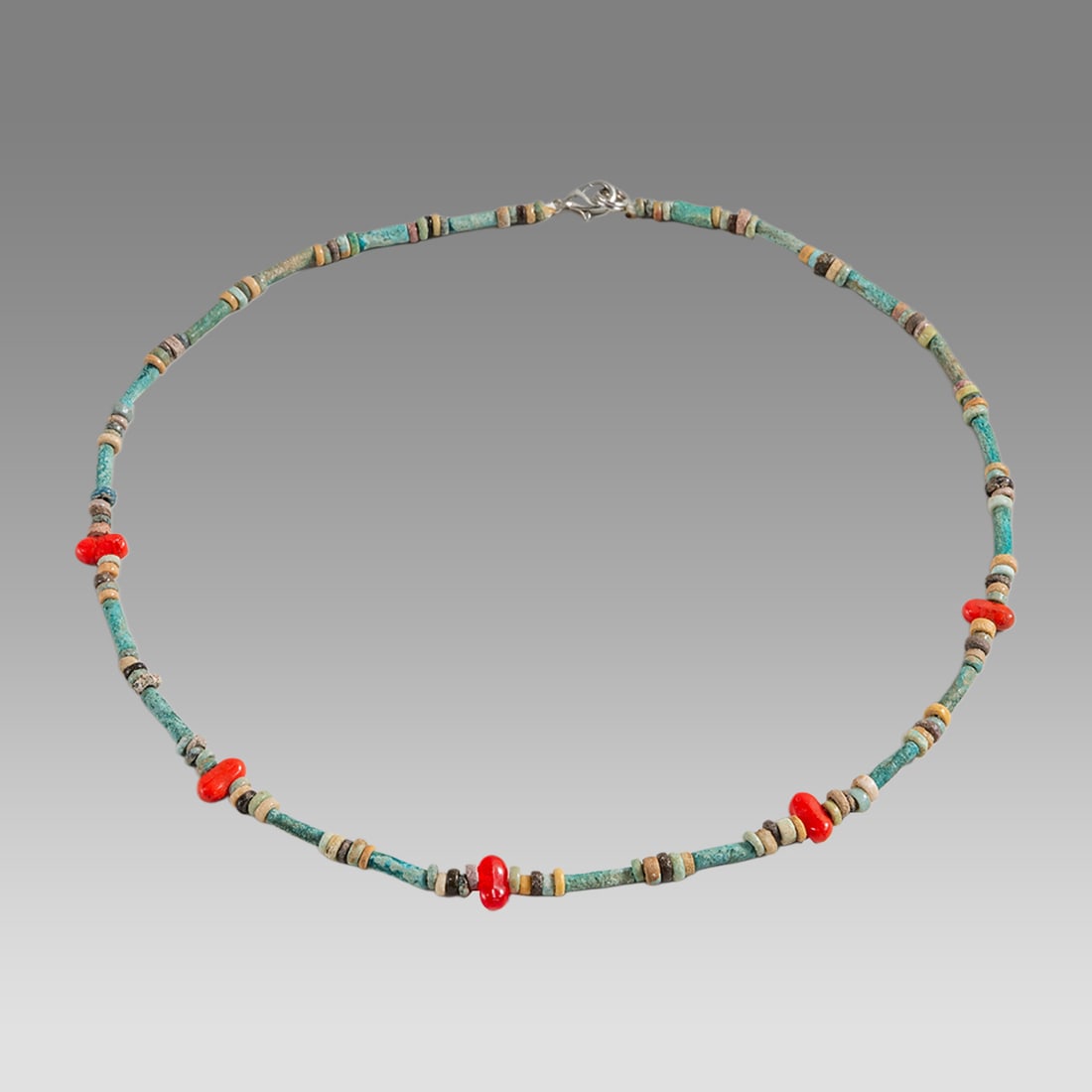 Ancient Egyptian Faience Bead Necklace c.300-50 BC.: Ancient Egyptian Faience Bead Necklace c.300-50 BC. Size 17 1/2 inches length. Great Looking single strand Faience Bead necklace with modern red beads. wearable. Provenance: Ex Secret Eyes Gallery New