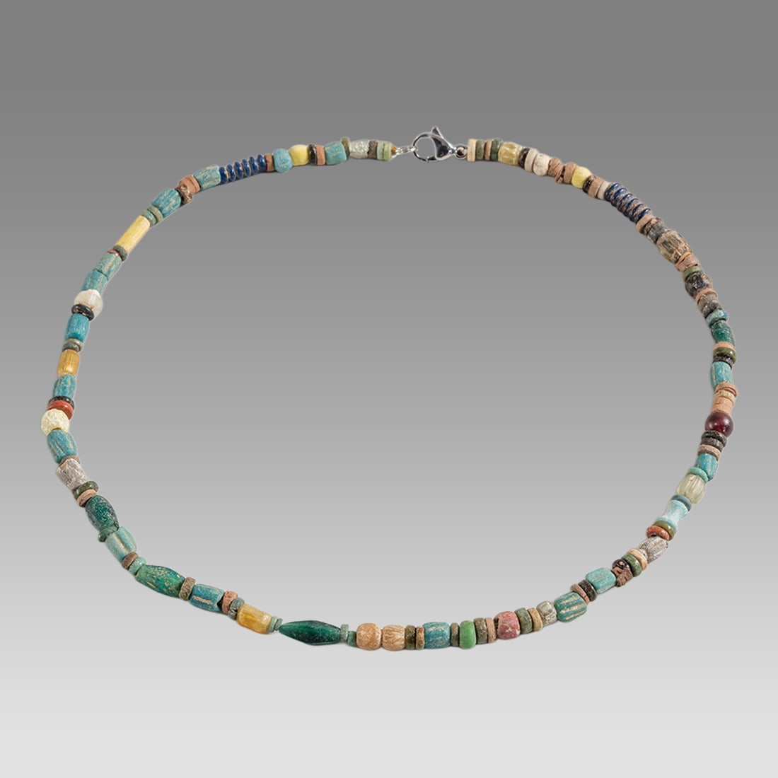 Ancient Egyptian Faience Bead Necklace c.300-50 BC.: Ancient Egyptian Faience Bead Necklace c.300-50 BC. Size 16 3/4 inches length. Great Looking single strand Faience Bead necklace mixed with Ancient Roman Glass beads. wearable. Provenance: Ex Secret E