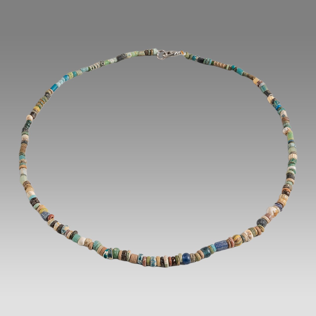 Ancient Egyptian Faience Bead Necklace c.300-50 BC.: Ancient Egyptian Faience Bead Necklace c.300-50 BC. Size 17 1/4 inches length. Great Looking single strand Faience Bead necklace mixed with Ancient Roman Glass beads. wearable. Provenance: Ex Secret E