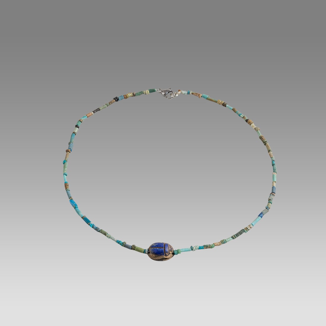 Ancient Egyptian Faience Bead Necklace c.300-50 BC.: Ancient Egyptian Faience Bead Necklace c.300-50 BC. Size 16 3/4 inches length. Great Looking single strand Faience Bead necklace with Lapis Lazuli Scarab. wearable. Provenance: Ex Secret Eyes Gallery