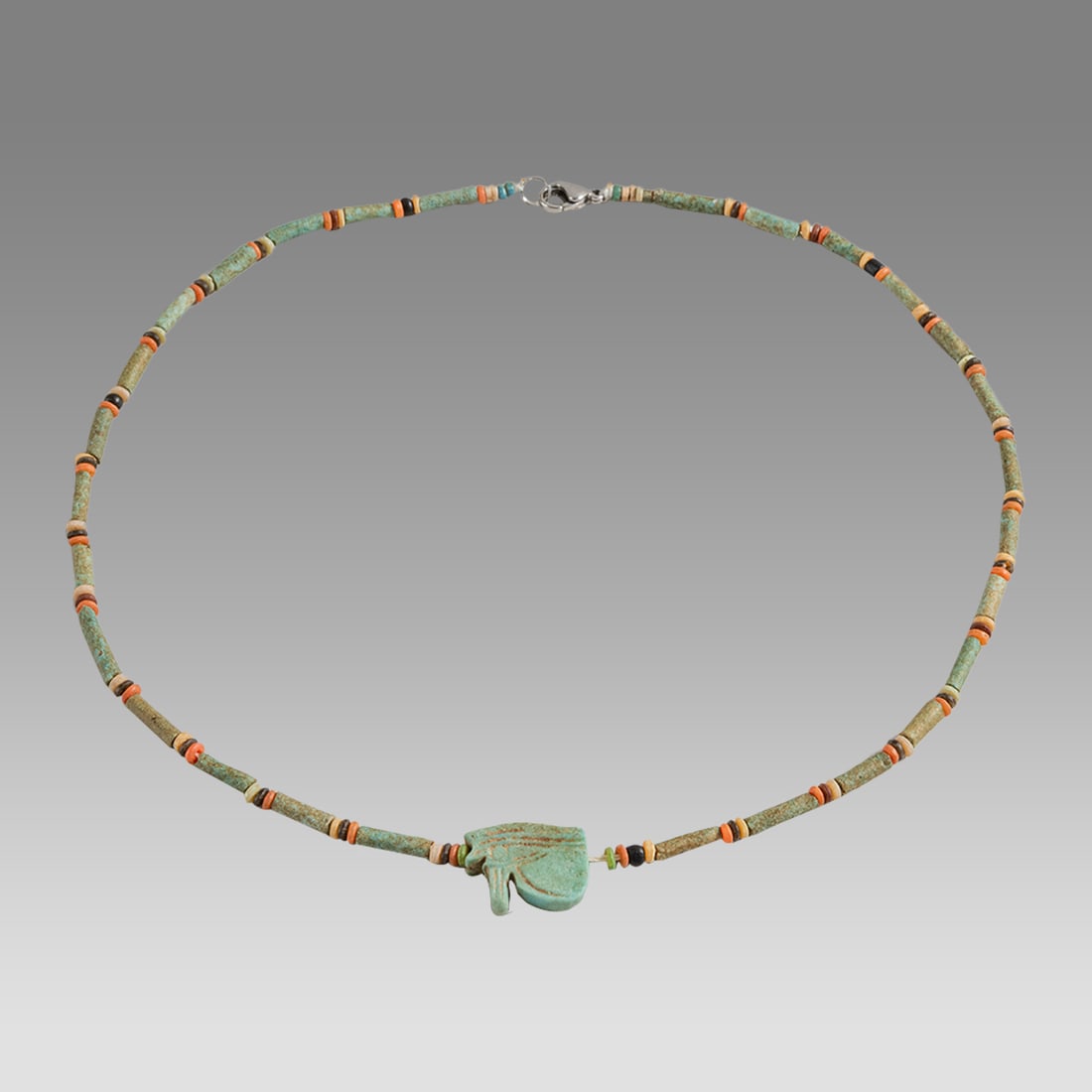 Ancient Egyptian Faience Bead Necklace c.300-50 BC.: Ancient Egyptian Faience Bead Necklace c.300-50 BC. Size 19 1/2 inches length. Great Looking single strand Faience Bead necklace with Ancient Faience Eye of Horus. wearable. Provenance: Ex Secret Eyes
