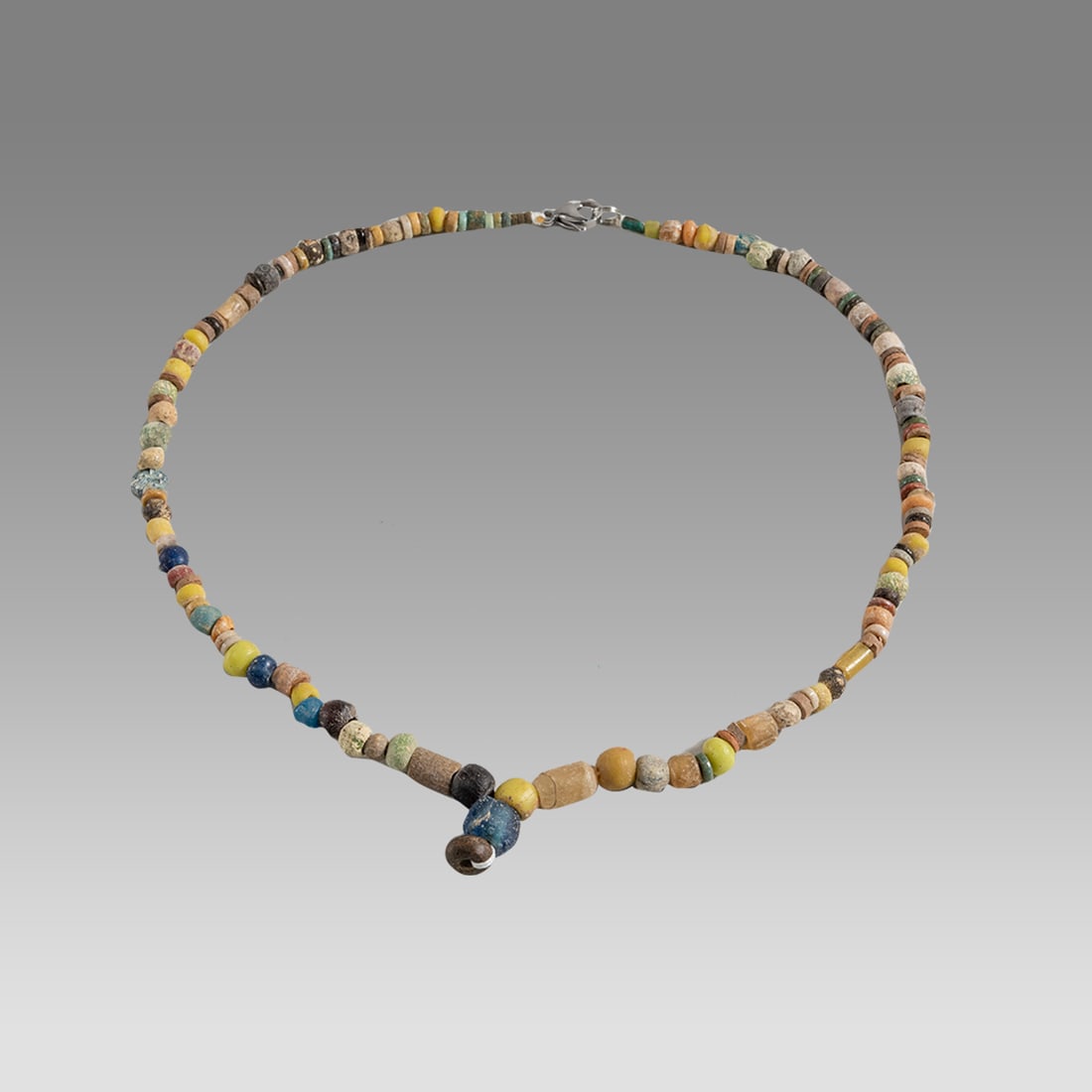Ancient Roman Glass Bead Necklace c.2nd-3rd century AD.: Ancient Roman Glass Bead Necklace c.2nd-3rd century AD. Size 17 1/2 inches length. Great Looking single strand glass Bead necklace. wearable. Provenance: Ex Secret Eyes Gallery New York 1970's-1980's.