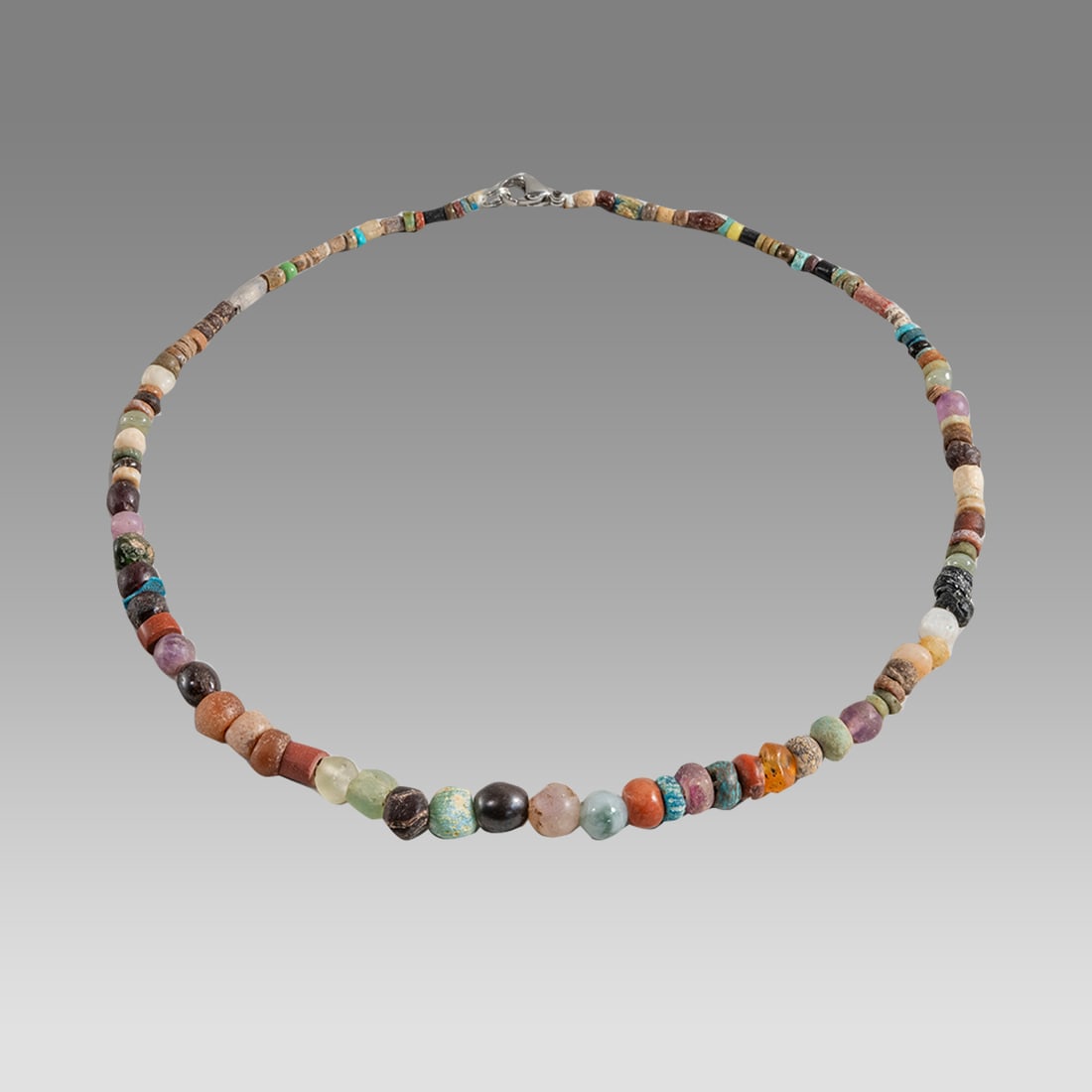 Ancient Roman Glass Bead Necklace c.2nd-3rd century AD.: Ancient Roman Glass Bead Necklace c.2nd-3rd century AD. Size 17 1/2 inches length. Great Looking single strand glass Bead necklace, with a couple of modern beads. wearable. Provenance: Ex Secret Eyes