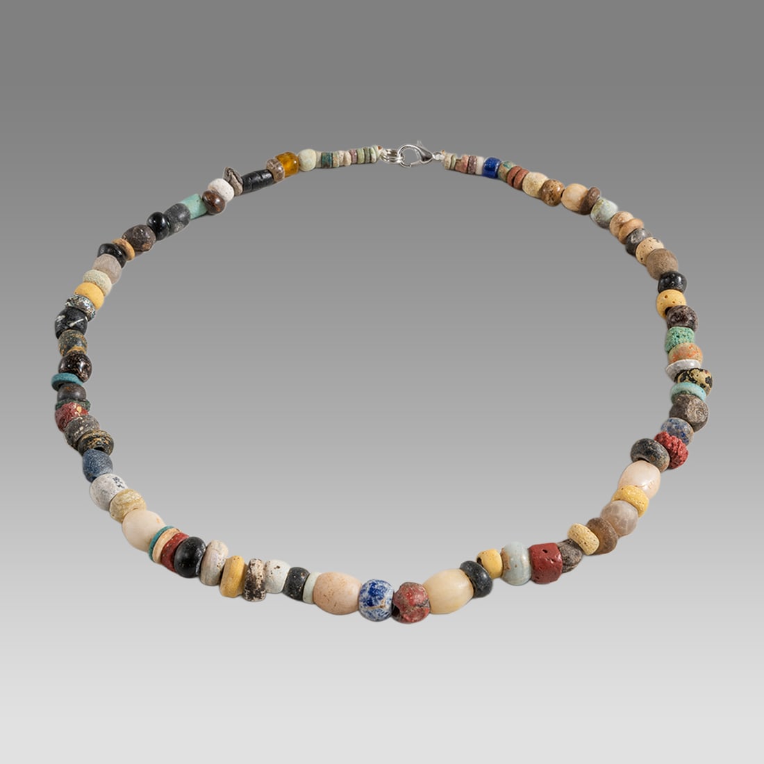 Ancient Roman Stone, Glass Bead Necklace c.2nd-3rd century AD.: Ancient Roman Stone, Glass Bead Necklace c.2nd-3rd century AD. Size 17 1/4 inches length. Great Looking single strand stone and glass Bead necklace. wearable. Provenance: Ex Secret Eyes Gallery New Yo