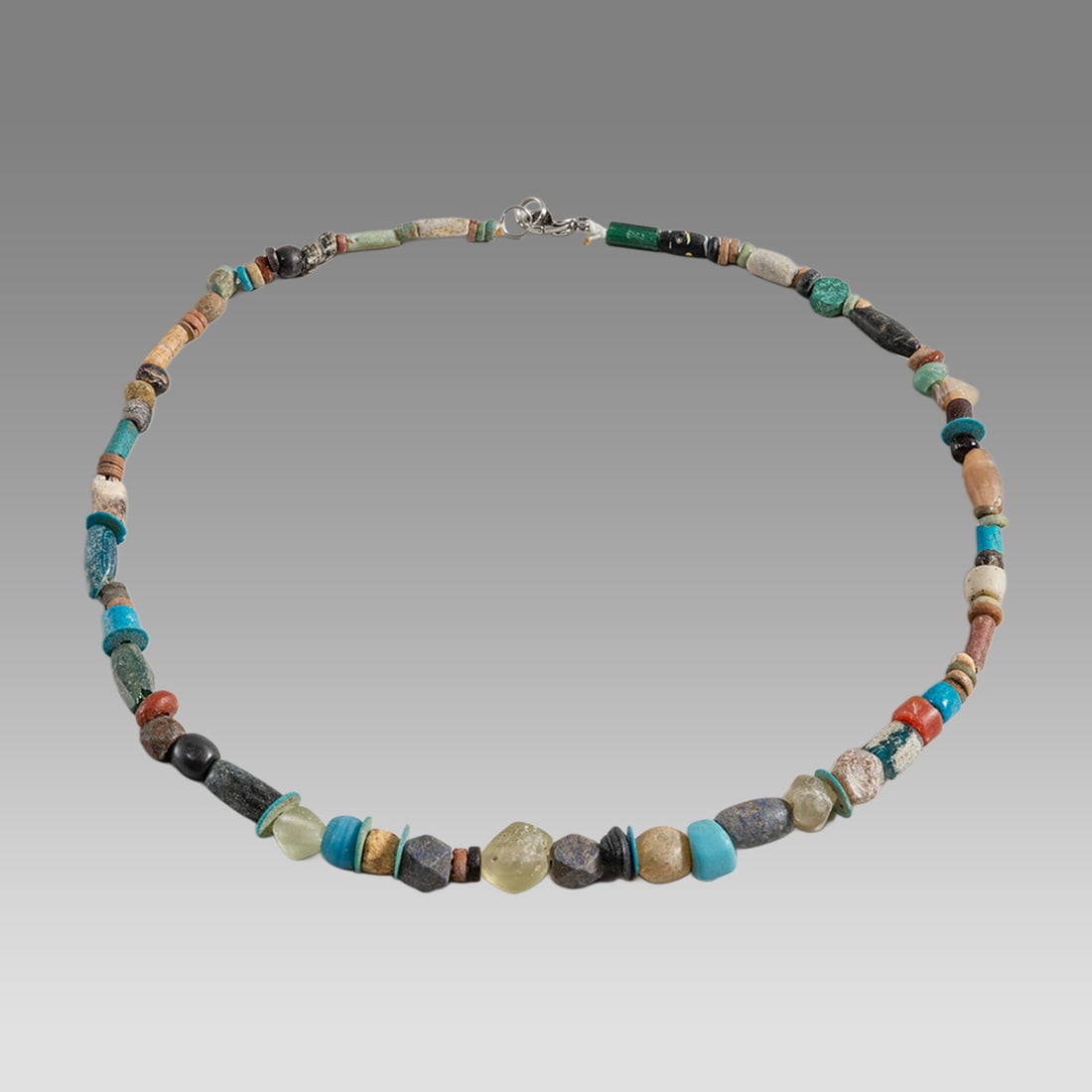 Ancient Egyptian Faience Bead Necklace c.300-50 BC.: Ancient Egyptian Faience Bead Necklace c.300-50 BC. Size 18 3/4 inches length. Great Looking single strand Faience Bead necklace with ancient Roman stone glass beads. wearable. Provenance: Ex Secret E