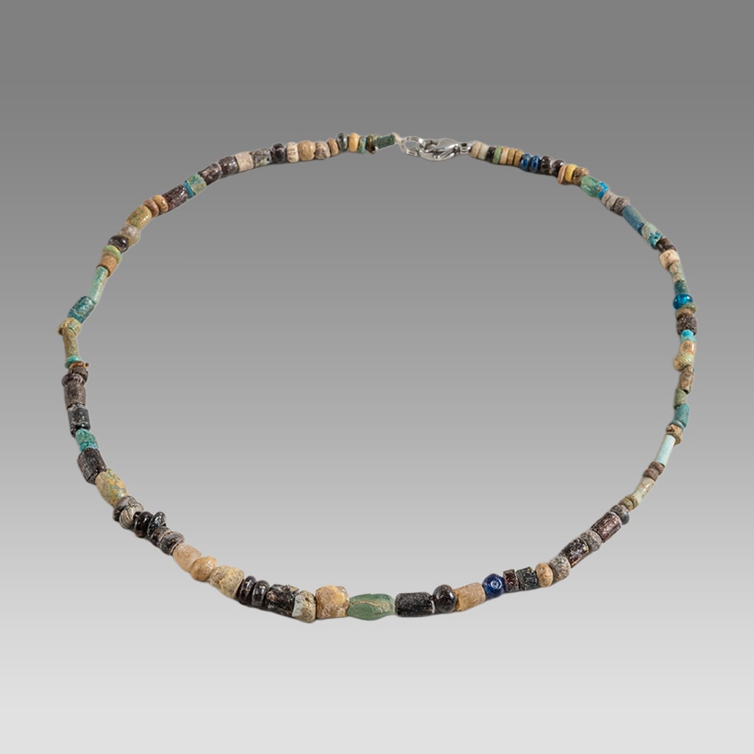 Ancient Roman Glass Bead Necklace c.2nd-3rd century AD.: Ancient Roman Glass Bead Necklace c.2nd-3rd century AD. Size 16 1/4 inches length. Great Looking single strand glass Bead necklace. wearable. Provenance: Ex Secret Eyes Gallery New York 1970's-1980's.