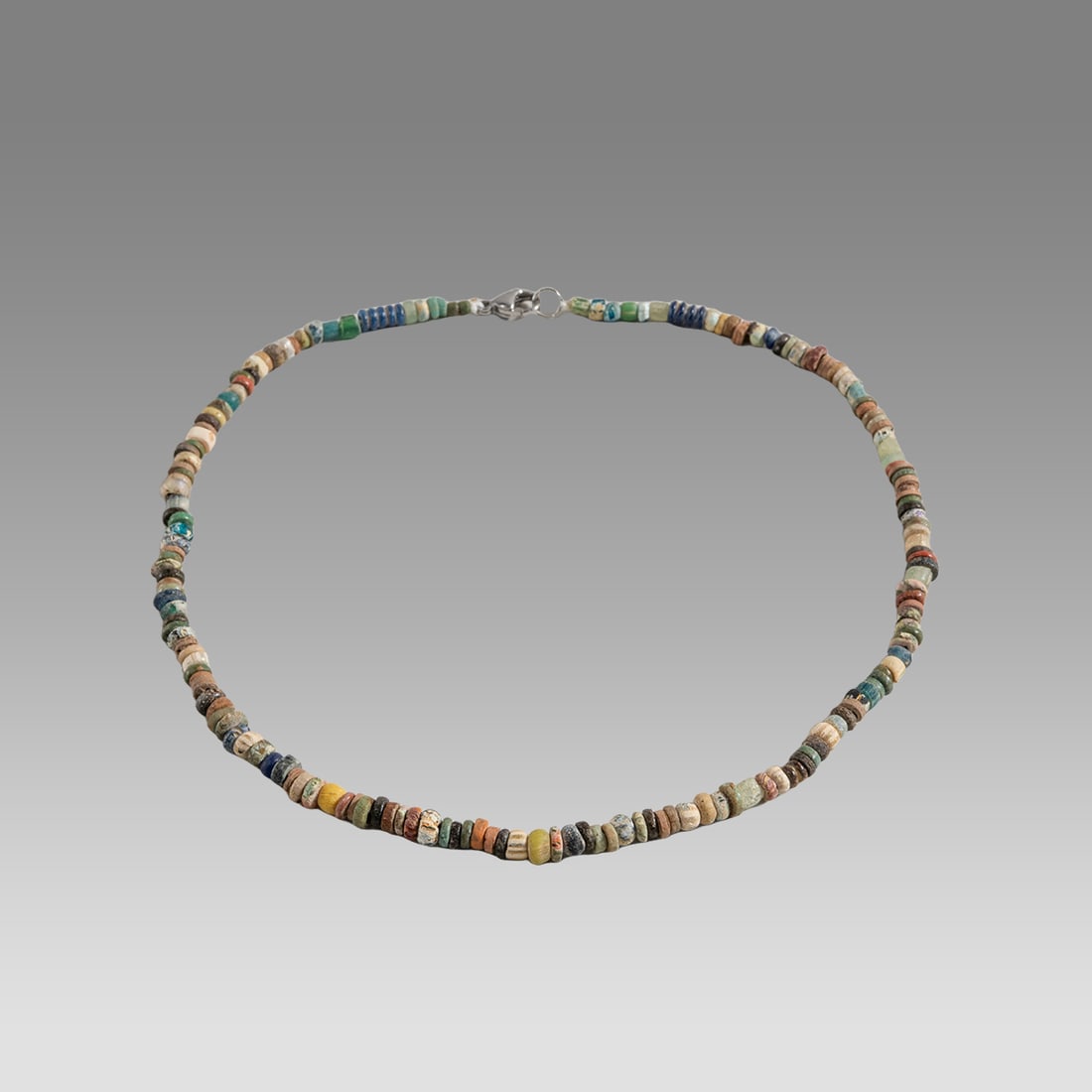 Ancient Egyptian Faience Bead Necklace c.300-50 BC.: Ancient Egyptian Faience Bead Necklace c.300-50 BC. Size 17 inches length. Great Looking single strand Faience Bead necklace mixed with Ancient Roman glass beads. wearable. Provenance: Ex Secret Eyes