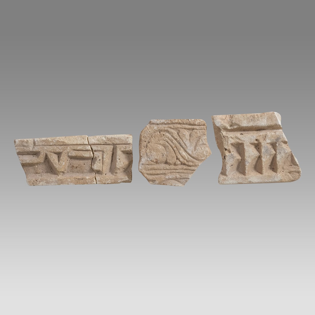 Lot of 4, 12th century Islamic Middle East Stucco Fragments with Arabic.: Lot of 4, 12th century Islamic Middle East Stucco Fragments with Arabic. Size 4 1/4 - 7 inches length. Fine collection of early Islamic Stucco wall Fragments with Kufic Arabic. Provenance: From Privat