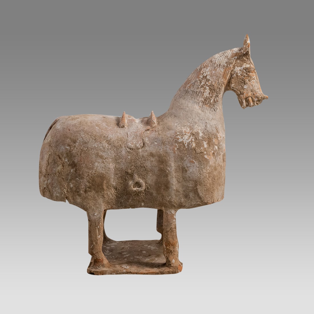Han Pottery Dressed Horse Han Dynasty, ca. 206 B.C. - 220 A.D., China.: Han Pottery Dressed Horse Han Dynasty, ca. 206 B.C. - 220 A.D., China. Size 15 inches high. 14 3/4 inches length, Orangeware pottery horse, having a hollow molded body and standing on four integral le