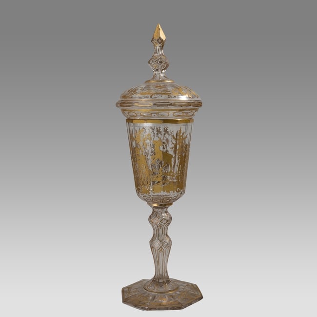 19th century European glass Goblet.: 19th century European glass Goblet. Size 14 inches high, 4 inches widest point. Fine European glass goblet with lid, decorated with hunter, Deer, hand painted gold floral decoration.