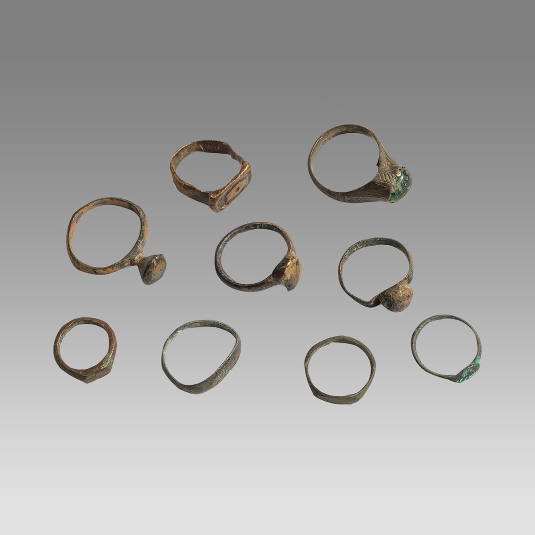 Lot of 9 Ancient Roman, Bronze Rings c.1st-3rd century AD.: Lot of 9 Ancient Roman, Bronze Rings c.1st-3rd century AD. Size 15-22 mm band size. 1-7 ring size. Fine collection of 9 cast bronze rings with nice find patina. Ex Florida collection.