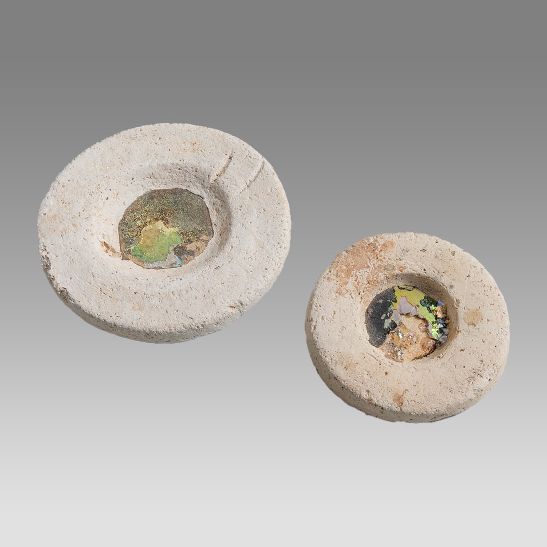 Lot of 2 Ancient Byzantine Plaster Mirros with Glass c.8th century AD.: Lot of 2 Ancient Byzantine Plaster Mirros with Glass c.8th century AD. Size 2 1/2 - 3 1/4 inches diameter. Fine lot of 2 circular form plaster mirrors with glass in the center. Ex Private Florida coll