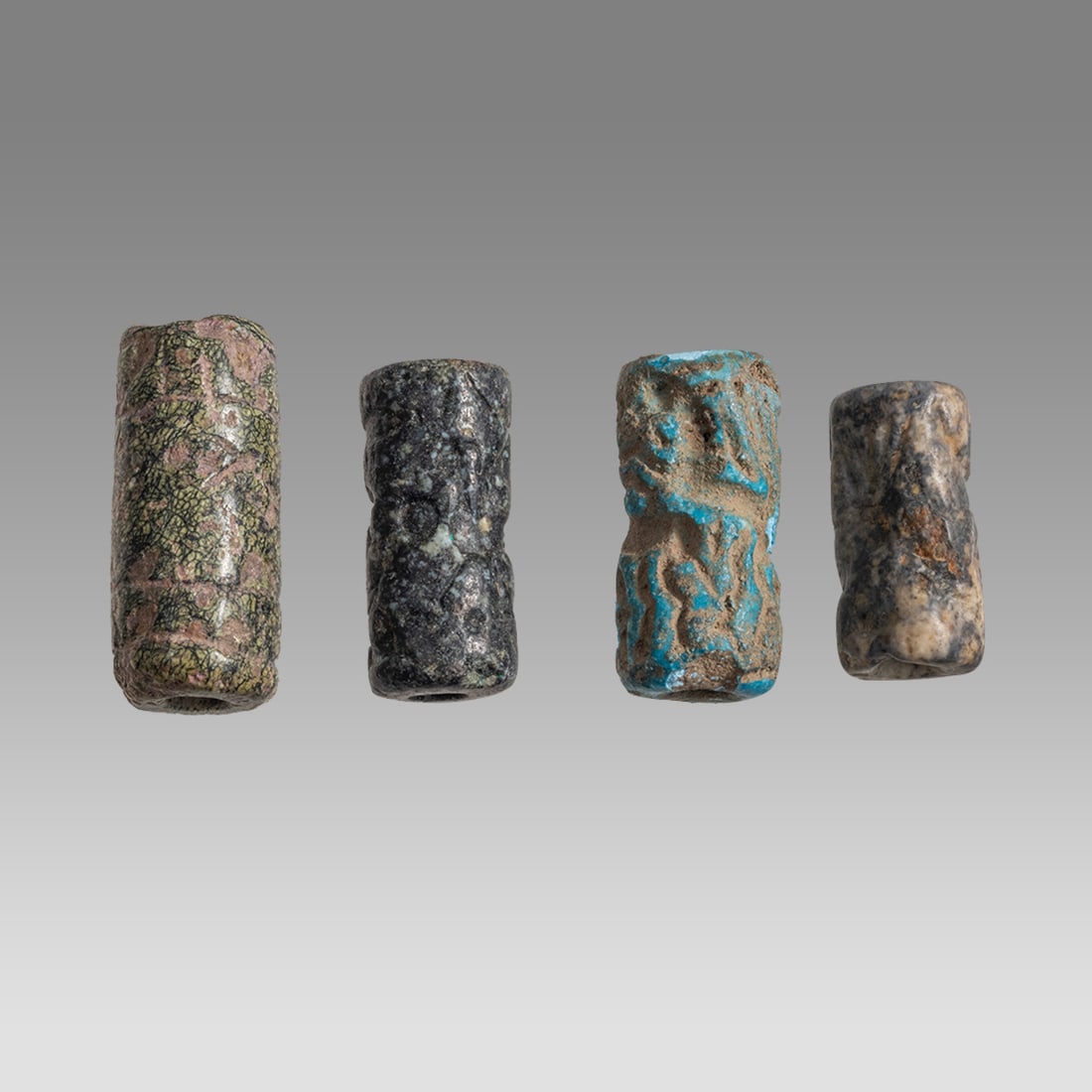 Lot of 4 Ancient Mesopotamian Stone Cylinder Seals. (1 of 2)