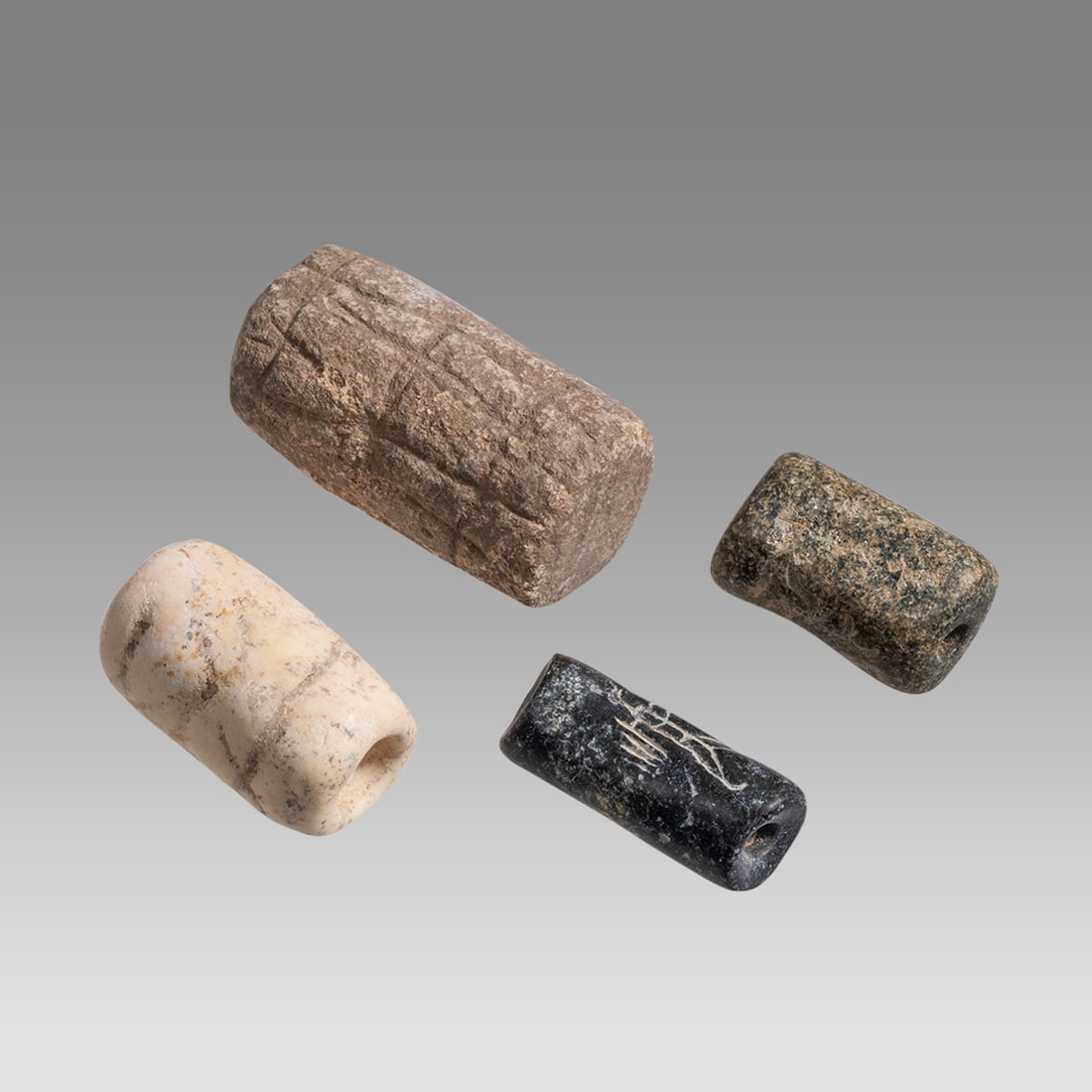 Lot of 4 Ancient Mesopotamian Stone Cylinder Seals. (1 of 2)