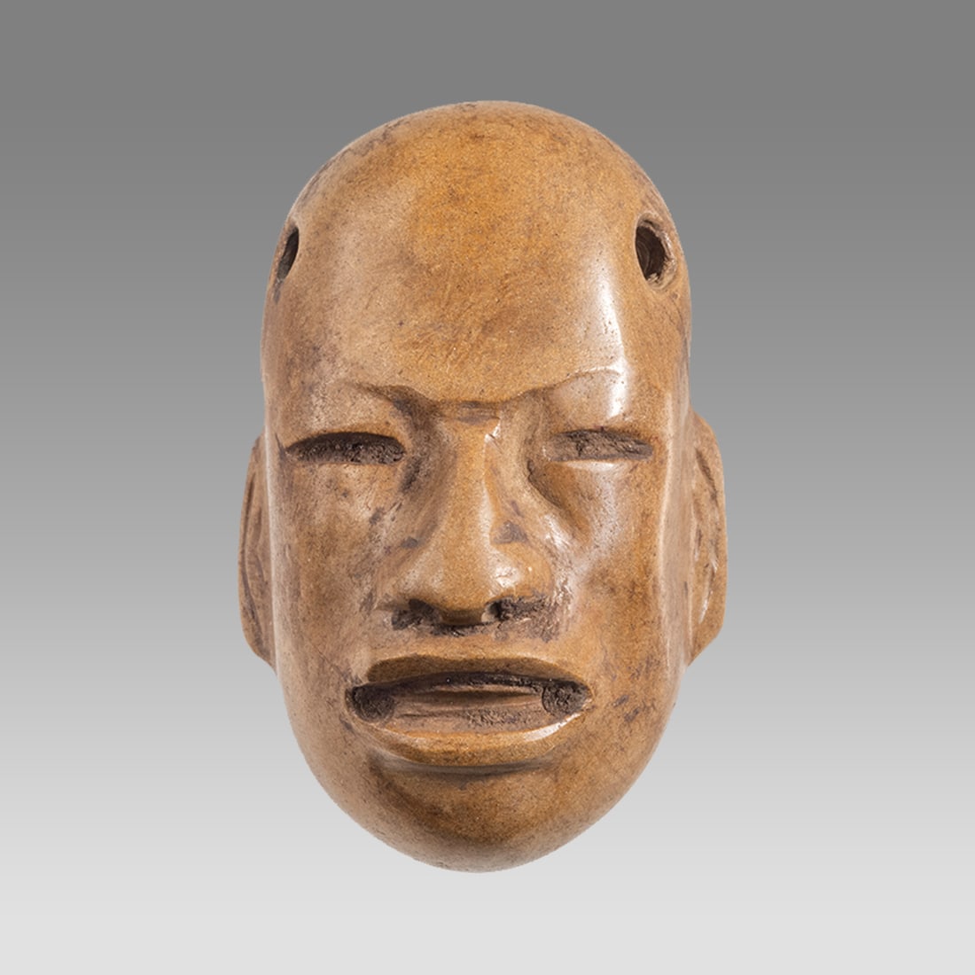 A Pre Columbian, Olmec Style Stone Mask. (1 of 3)