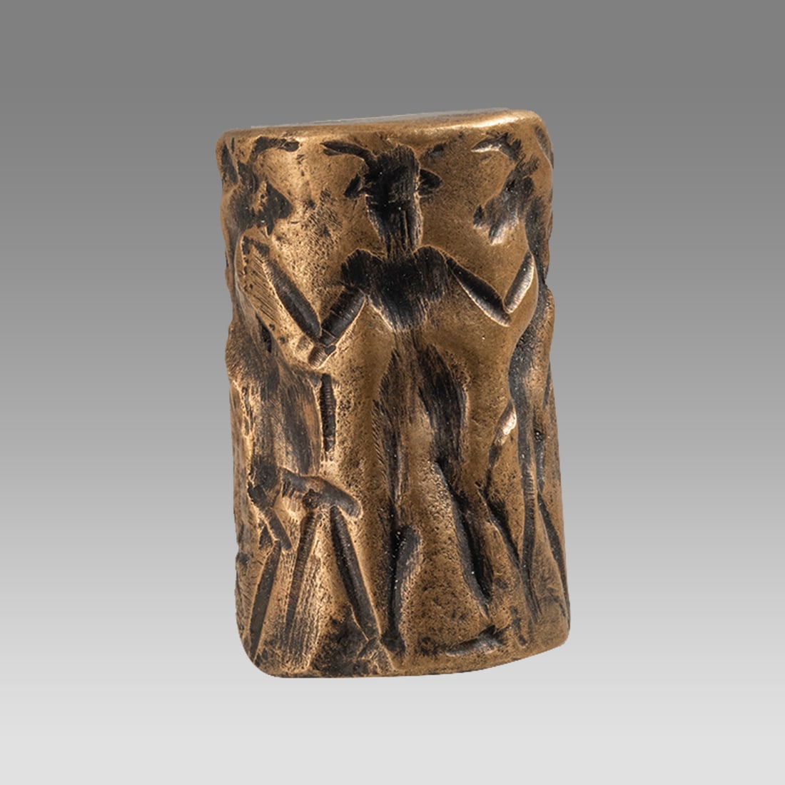 A Mesopotamian Bronze Cylinder Seal. (1 of 2)