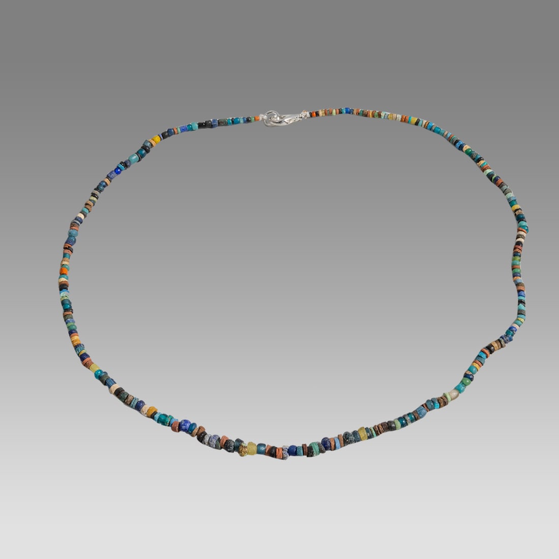 Ancient Roman Glass Bead Necklace c.200 AD.: Ancient Roman Glass Bead Necklace c.200 AD. Size 18 1/4 inches length. Great Looking single strand glass bead necklace. wearable. Provenance: Ex Secret Eyes Gallery New York 1970's-1980's