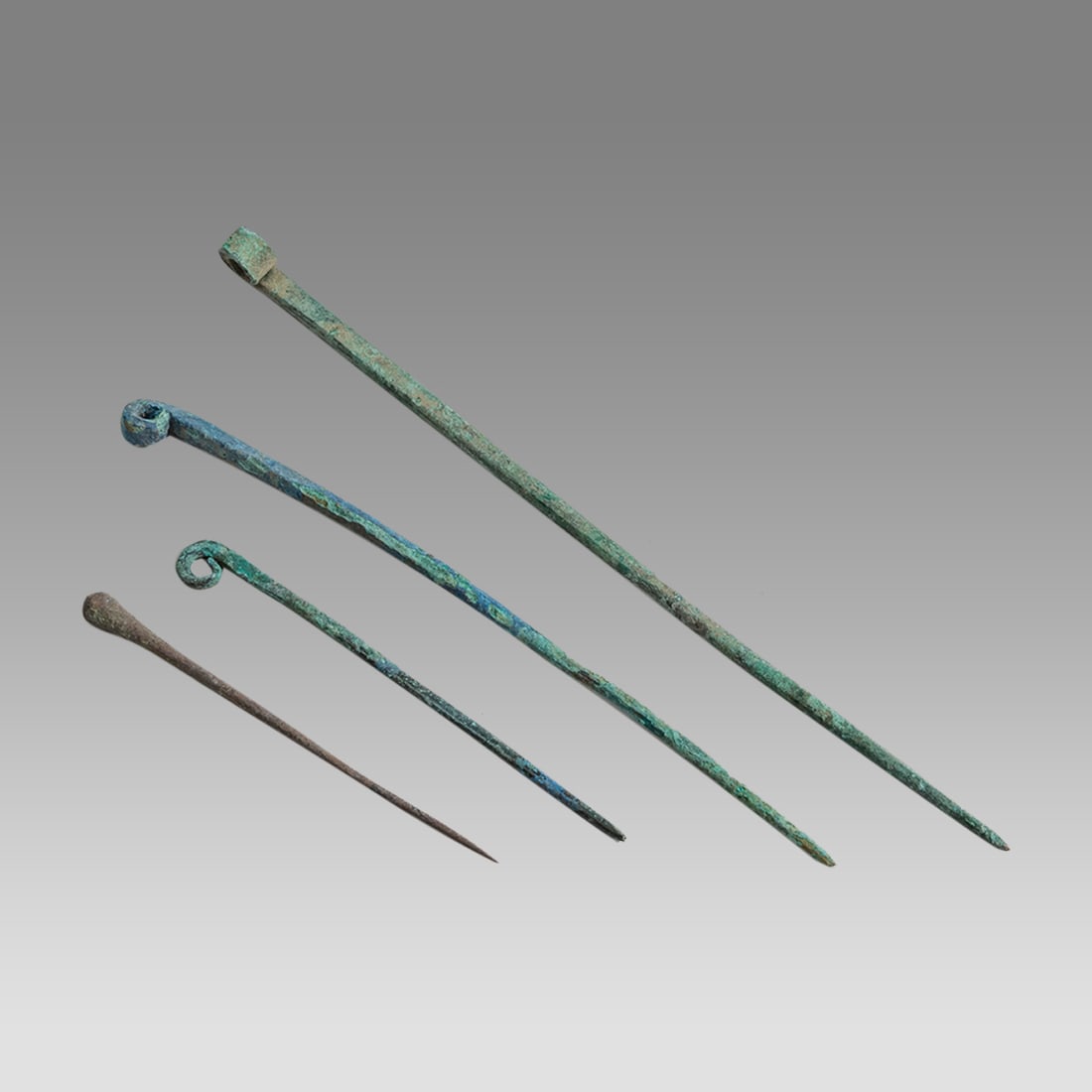 Lot of 4 Ancient Bronze Clothing Pins, Koban, 1200-400 BC.: Lot of 4 Ancient Bronze Clothing Pins, Koban, 1200-400 BC. Size 3 1/4 - 6 5/8 inches length. Fine Cast bronze hair pins with suspension hole. Provenance: From a private Altmar, New York Collection.