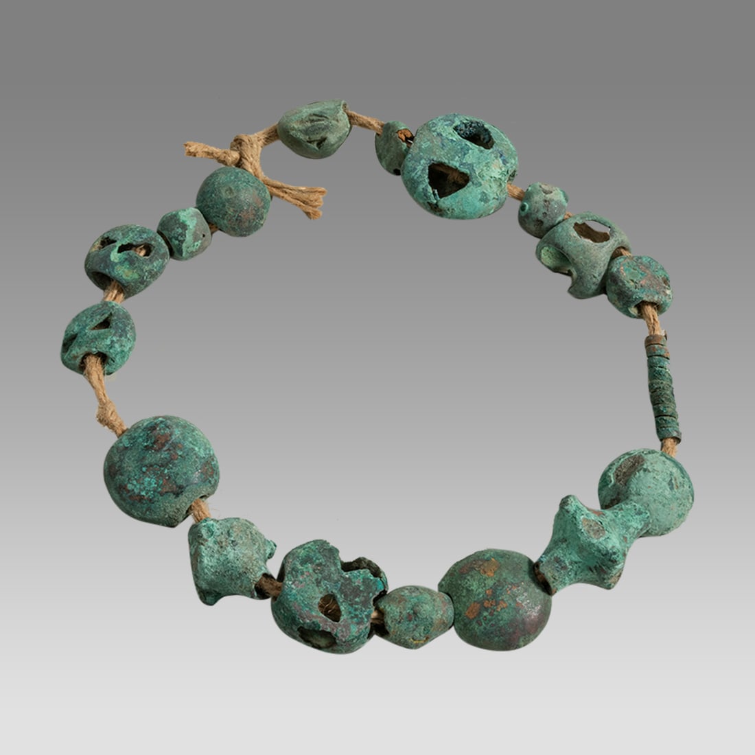 Ancient Koban, Bronze Beads c.1200-400 BC. (17): Ancient Koban, Bronze Beads c.1200-400 BC. (17) Size of each bead 17 - 35 mm. Fine cast bronze beads, in a string. Provenance: From a private Altmar, New York Collection.