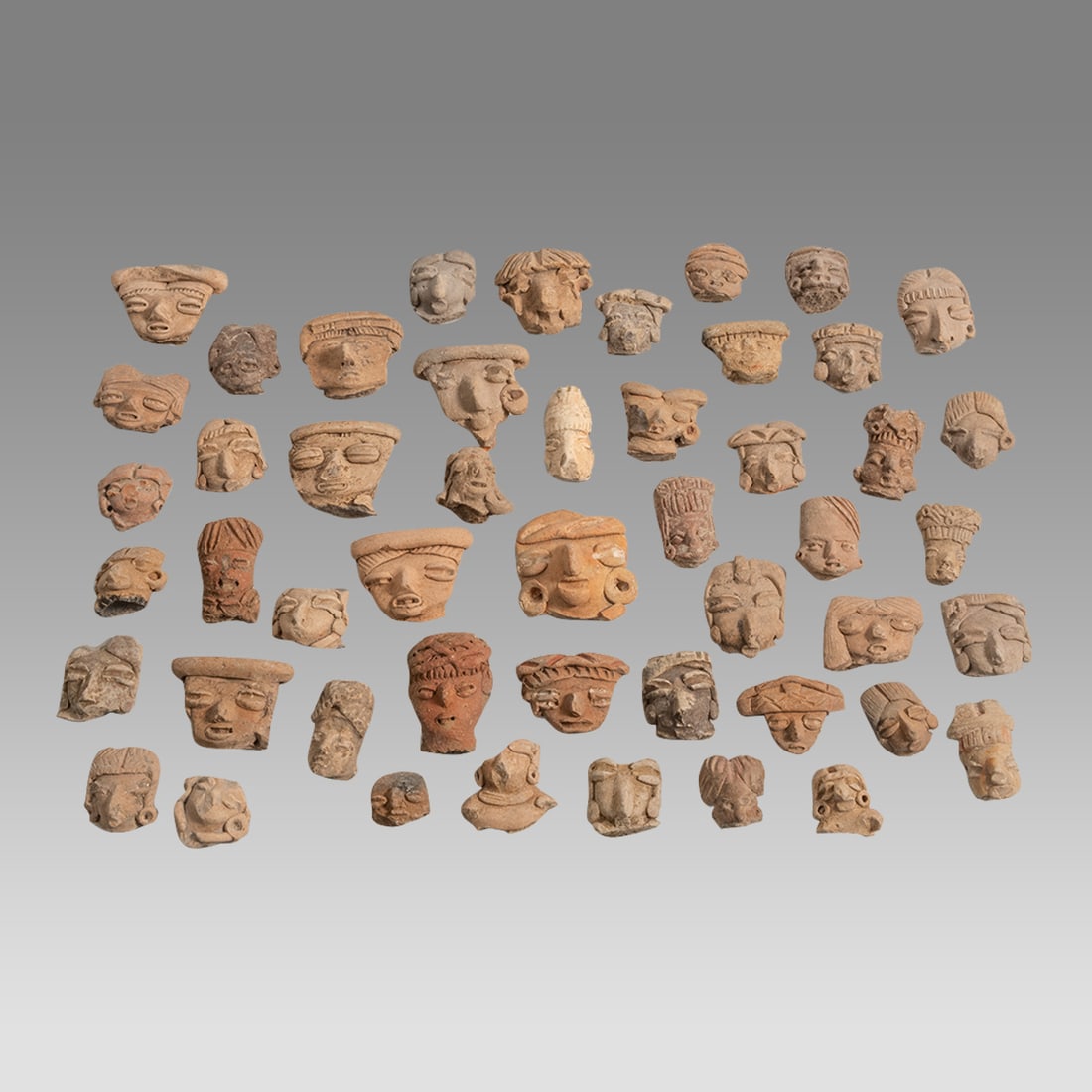 Lot of 50 Ancient Pre Columbian Pre-Classic Pottery Heads. (1 of 1)