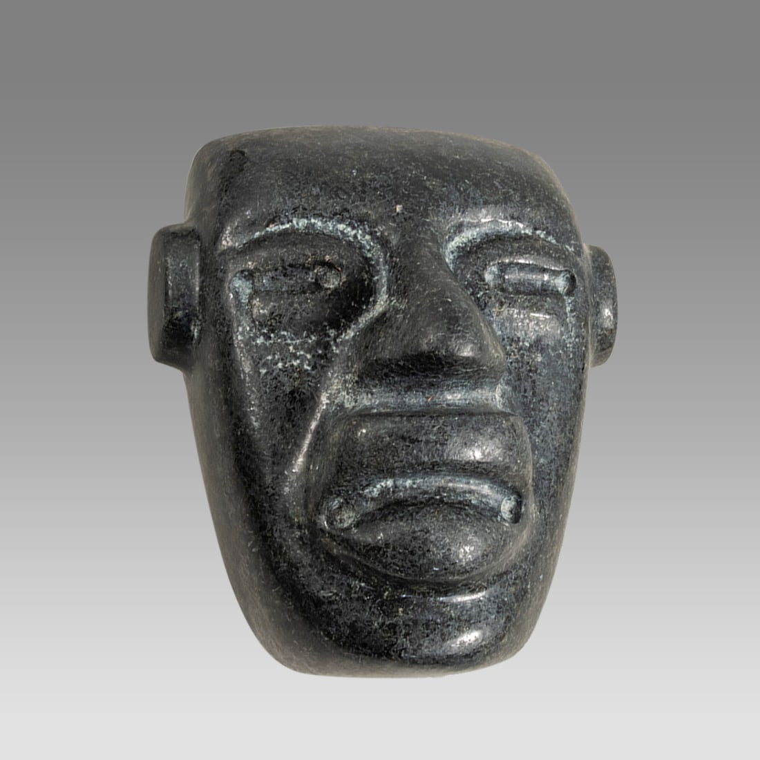 A Pre Columbian Style Carved Stone Mask. (1 of 1)