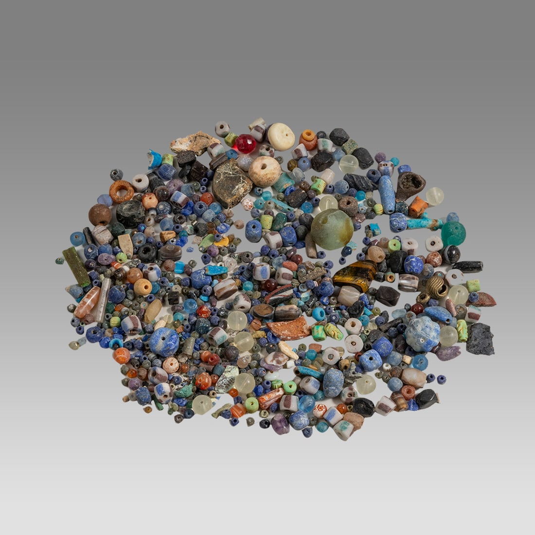 Lot of Ancient Roman and Islamic Agate and Glass Loose Beads.: Lot of Ancient Roman and Islamic Agate and Glass Loose Beads. Size 5 - 30 mm. Fine Lot of mixed Stone, Agate and Glass Beads. Provenance: Ex NYC Collection acquired in the London Market.