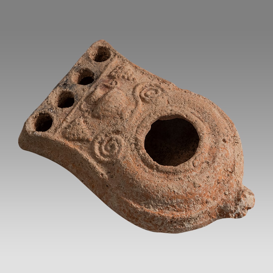 Ancient Holyland Judaean Terracotta Oil Lamp 2nd Temple c.1st century AD.: Ancient Holyland Judaean Terracotta Oil Lamp 2nd Temple c.1st century AD. Size 4 1/2 inches length, 2 3/4 inches width. Fine large terracotta oil lamp with four spouts the shoulder decorated with 2 Gr