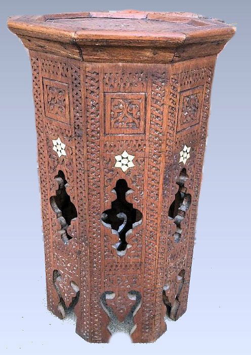 A Syrian Carved wood octagonal coffee table inlaid with: A Syrian Carved wood octagonal coffee table inlaid with Mother-of-Pearl, early 20th Century. Size H.- 17 1/4 in., 11 1/4 inches diameter. From a New Orleans estate.
