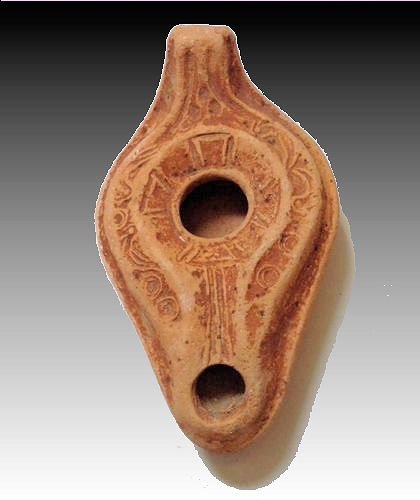 Ancient Holy land Byzantine Empire Terracotta Oil Lamp: Ancient Holy land Byzantine Empire Terracotta Oil Lamp with a Cross c.200-400 AD. Very Unusual Molded red clay oil lamp with a Cross in the center and design. used for lighting. Size 4 inches long (10