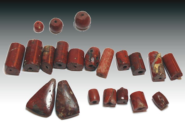 21 ANCIENT PRE-COLUMBIAN TAIRONA RED JASPER BEADs: Lot of 21 Large ANCIENT PRE-COLUMBIAN TAIRONA CYLINER RED JASPER BEADs c.800-1500 AD. Size 30 x 20 mm. the largest. Provenance: Ex; Florida Collection Cecil Martin.