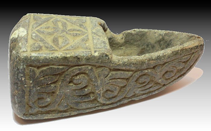 Ancient Coptic Egypt Stone Oil Lamp with a Cross: Ancient Coptic Egypt Stone Oil Lamp with a Cross c.500 AD.Size:5 inches Length x 2 inches wide. Unusual Ancient stone Oil Lamp with floral design and a Cross. Provenance: Ex California Estate.
