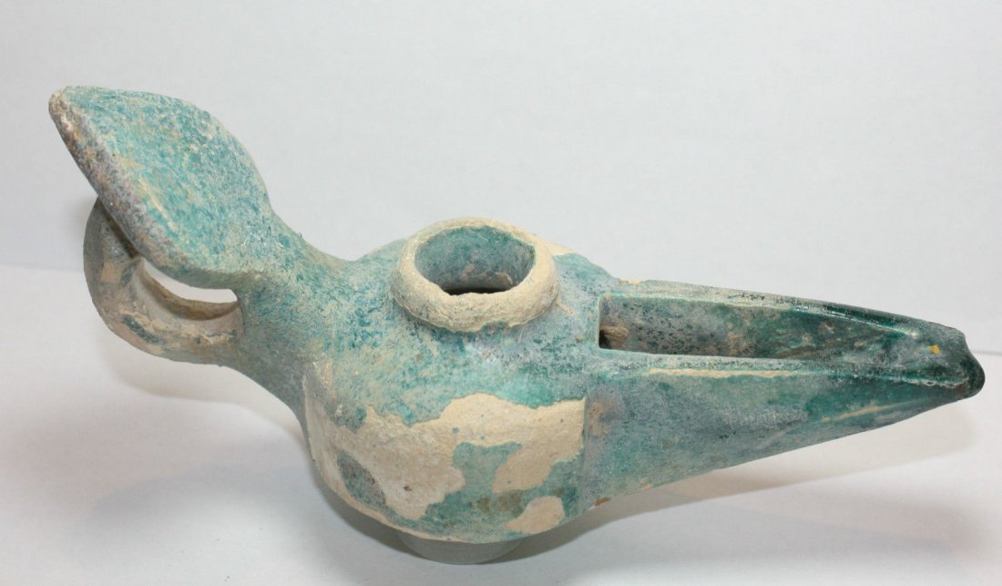 Ancient Persian Islamic Kashan ceramic Oil Lamp Ca.13th: Ancient Persian Islamic Kashan ceramic Oil Lamp Ca.13th century AD.Size: 6 inches long (15.2 cm) Great looking Persian Islamic Ceramic Glazed oil lamp, used for lighting, c.13th century. Condition: ch