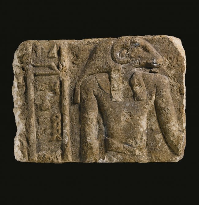 ANCIENT EGYPTIAN LIMESTONE RELIEF FRAGMENT, PTOLEMAIC: ANCIENT EGYPTIAN LIMESTONE RELIEF FRAGMENT, LATE PTOLEMAIC / EARLY ROMAN PERIOD, CIRCA 1ST CENTURY B.C.carved in bold relief with ram-headed Khnum, god of creation and fertility, facing right and wear