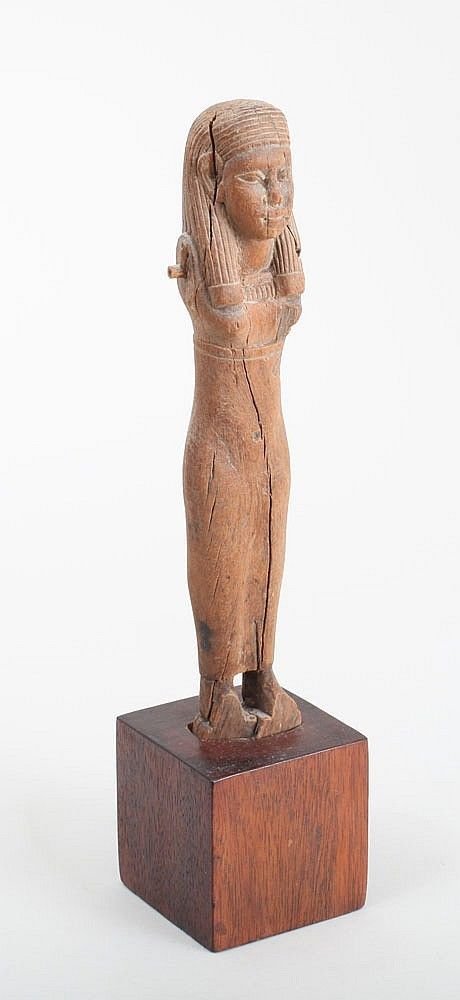 Ancient Egyptian Carved wood figure of a Lady c.700 BC: Ancient Egyptian Carved wood figure of a Lady Egypt, Late Period,700 BC. Size 8 1/2 inches (21.5 cm)Fine EGYPTIAN CARVED WOOD FIGURE OF A Lady Set into wood block-form stand; lacking articulated arms.