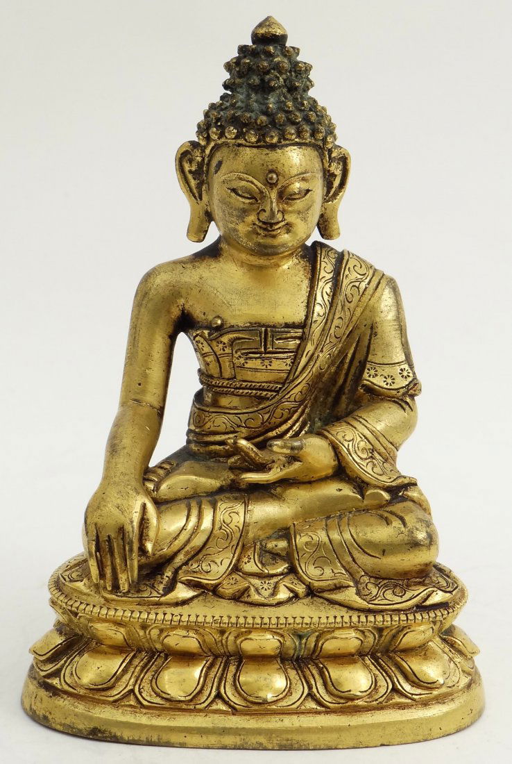 Agilt bronze figure of Buddha, Tibet, 17th Century. (1 of 4)
