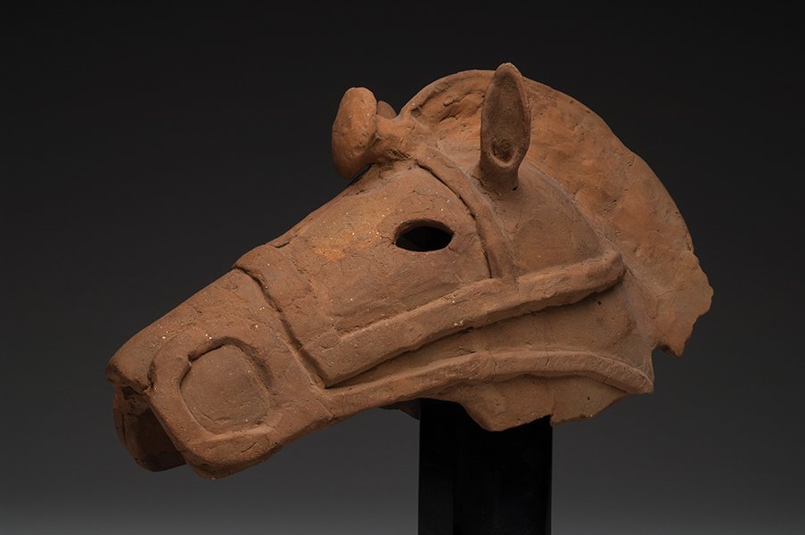Ancient Haniwa Pottery Horse Head Kofun Period, ca. 300: Ancient Haniwa Pottery Horse Head Kofun Period, ca. 300-600 A.D.Size:15-1/2”L. x 9-1/4”H.Large salmon-buff color hollow pottery horse head, depicted with a raised mane, perked ears and openwork ey
