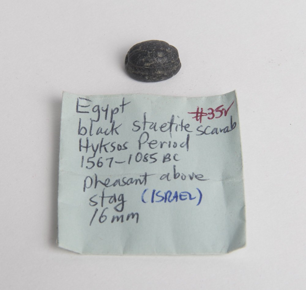Ancient Egyptian Black Stone Scarab Ca. 1500-30 B.C.: Ancient Egyptian Black Stone Scarab Ca. 1500-30 B.C. Size 16 x 13 mm. Beautiful Black Stone scarab. Perfect. Provenance: Ex New York City collection acquired 1970's