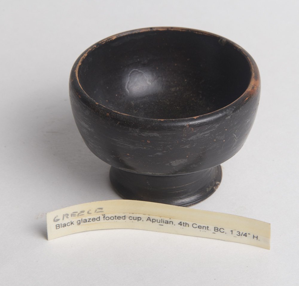Ancient South Italian Apulian Pottery Cup c.4th century: Ancient South Italian Apulian Pottery Cup c.4th century BC. Size 2 1/2 inches diameter x 1 3/4 inches high. Nice Form of ancient Apulian footed cup. Perfect condition. Provenance: Ex Lester Gross Coll