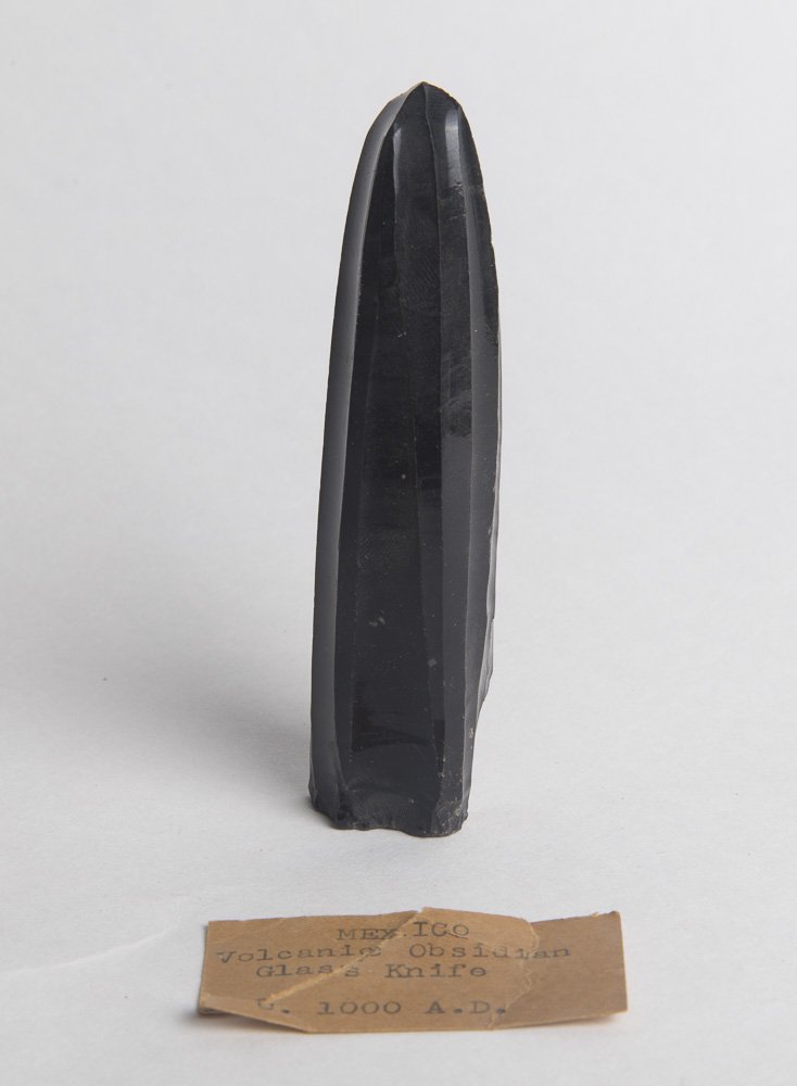 Ancient Mexico Volcanic Obsidian Glass Knife c.1000 AD: Ancient Mexico Volcanic Obsidian Glass Knife c.1000 AD. Size 4 inches length. Good condition. Provenance: Ex Lester Gross Collection New York City 1970's.