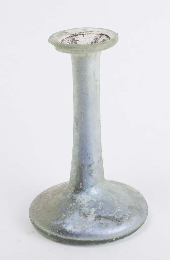 Ancient Roman Glass Bottle c.1st-2nd cent AD.: Ancient Roman Glass Bottle c.1st-2nd cent AD. Size 3 7/8 inches high. Beautiful ancient light blue-green blown glass bottle, having long neck. silvery iridescent patina. Condition chipped at the rim o