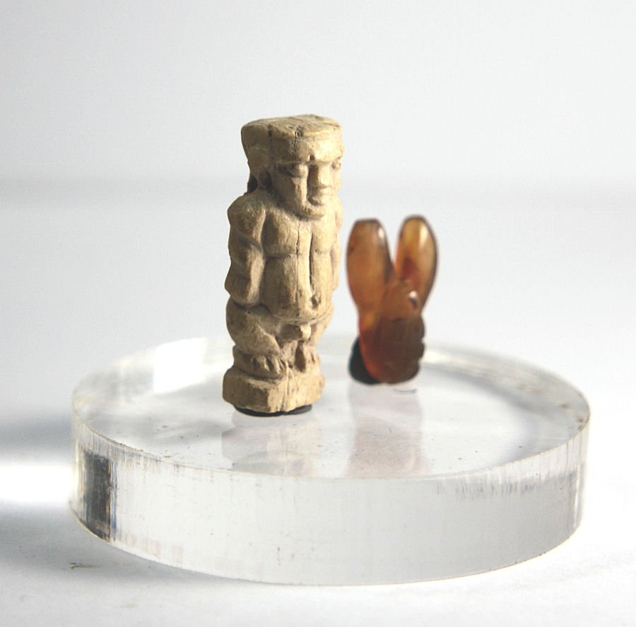 Ancient Egyptian Paitakos dwarf Amulet Late Period: Ancient Egyptian Paitakos dwarf Amulet Late Period c. 664-32 BC. Size 24 mm. A carved bone standing nude Paitakos dwarf, arms set to the side, head forward. Pierced at back for suspension. together wi