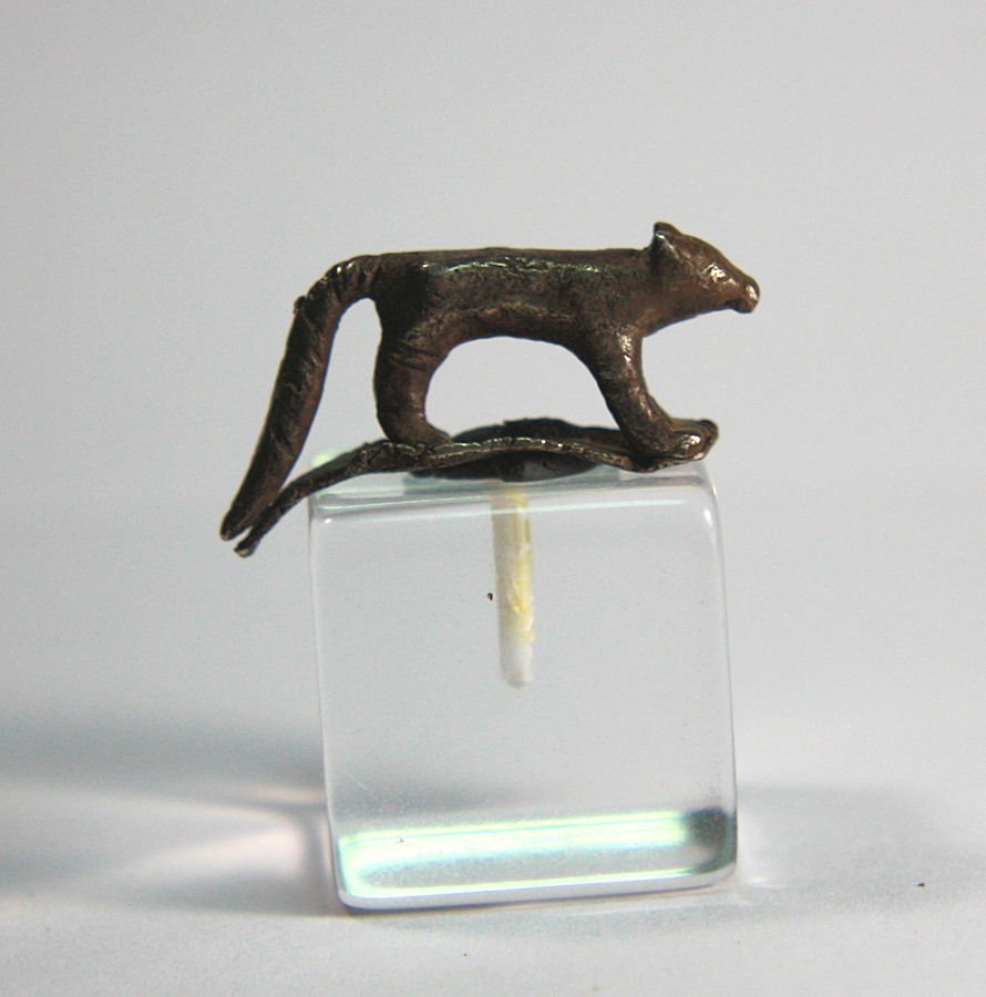 ancient Egyptian Silver Animal c.664 BC: ancient Egyptian Silver Animal c.664 BC. Size 25 mm. A Silver shrew with head forward, long tail extending from back. Condition: base chipped otherwise Perfect. Provenance: Maryland collection. acquir